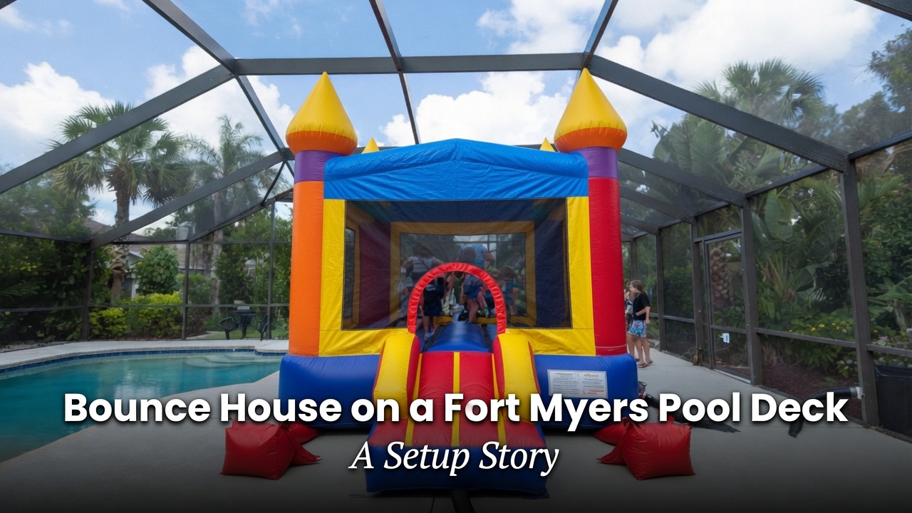 Small bounce house anchored with red sandbags on a concrete pool deck in a Fort Myers backyard with palms