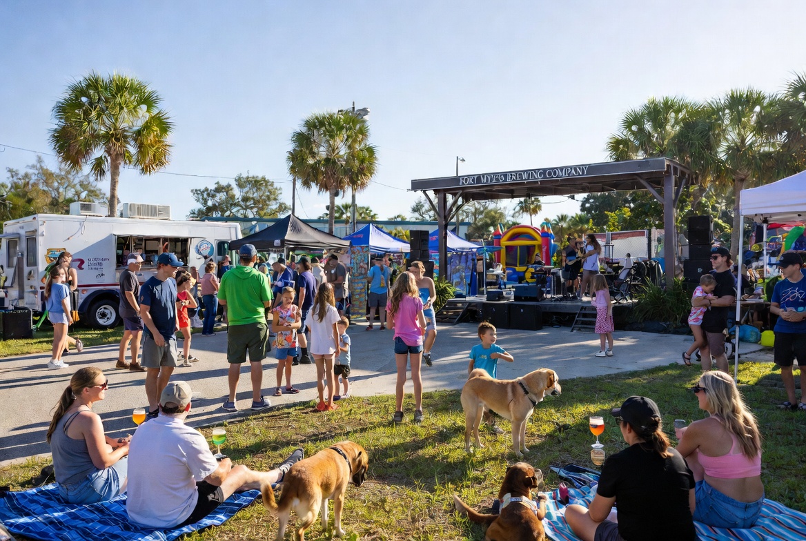Outdoor crowd with food trucks and live music at Fort Myers Brewing Company Grouper Fest with families and kids
